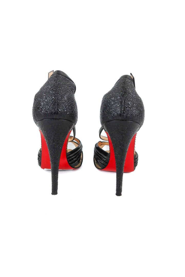 Christian Loubouton black heels (41; retail $1,195)