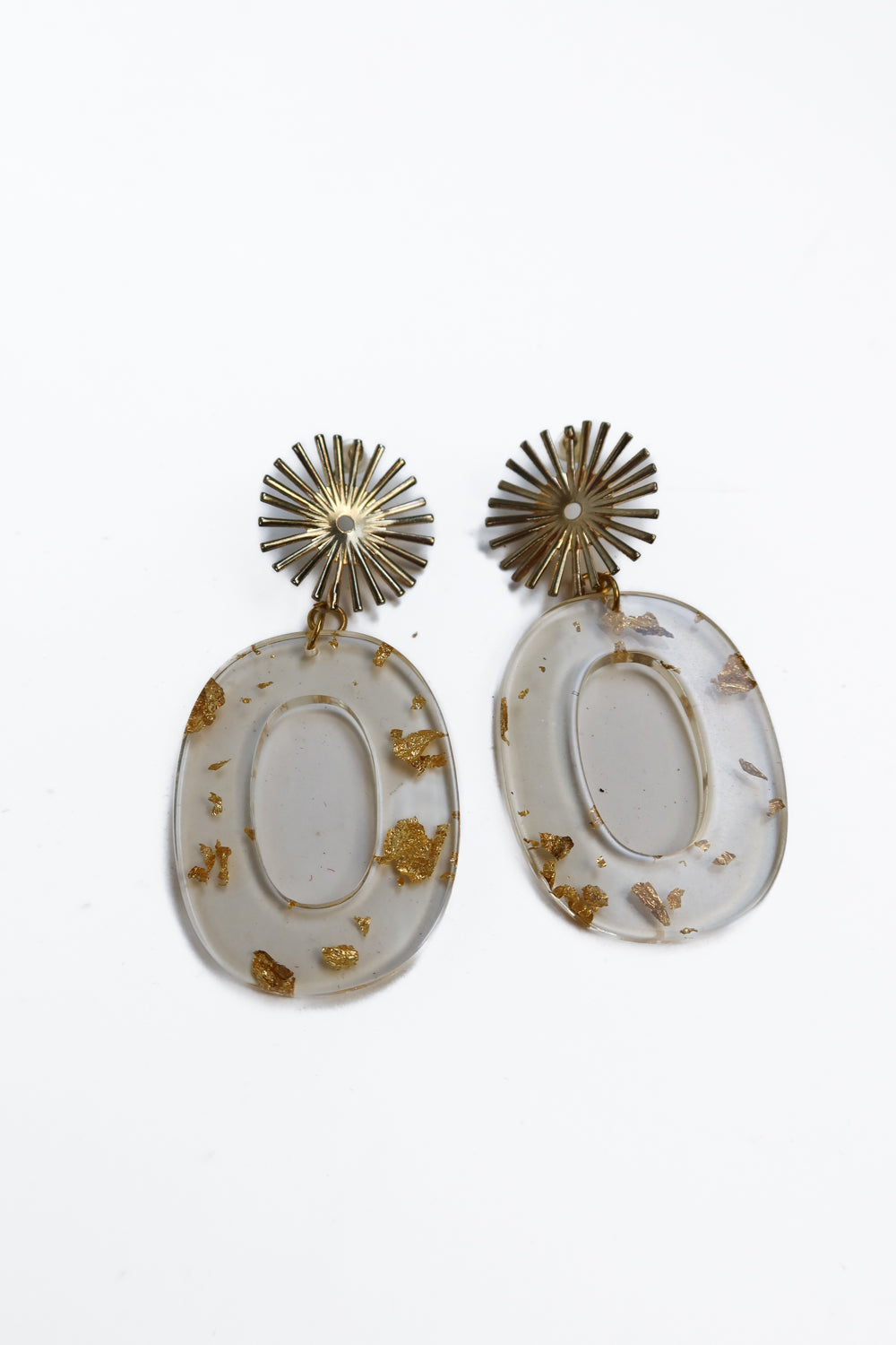 Oval earrings with gold flecks and floral detail