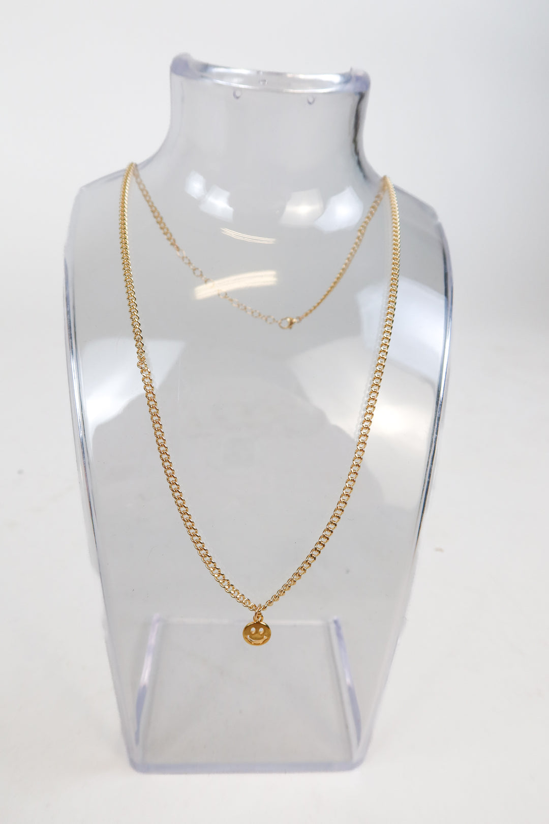 ALV jewels gold smiley necklace (retails for $60)
