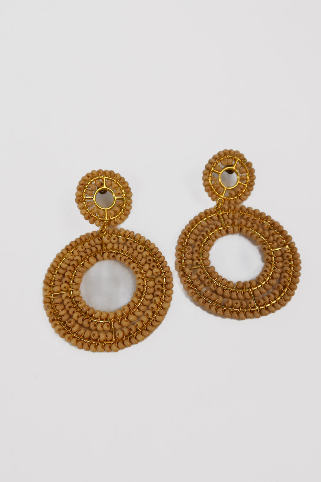 Light pink and gold beaded circle earrings