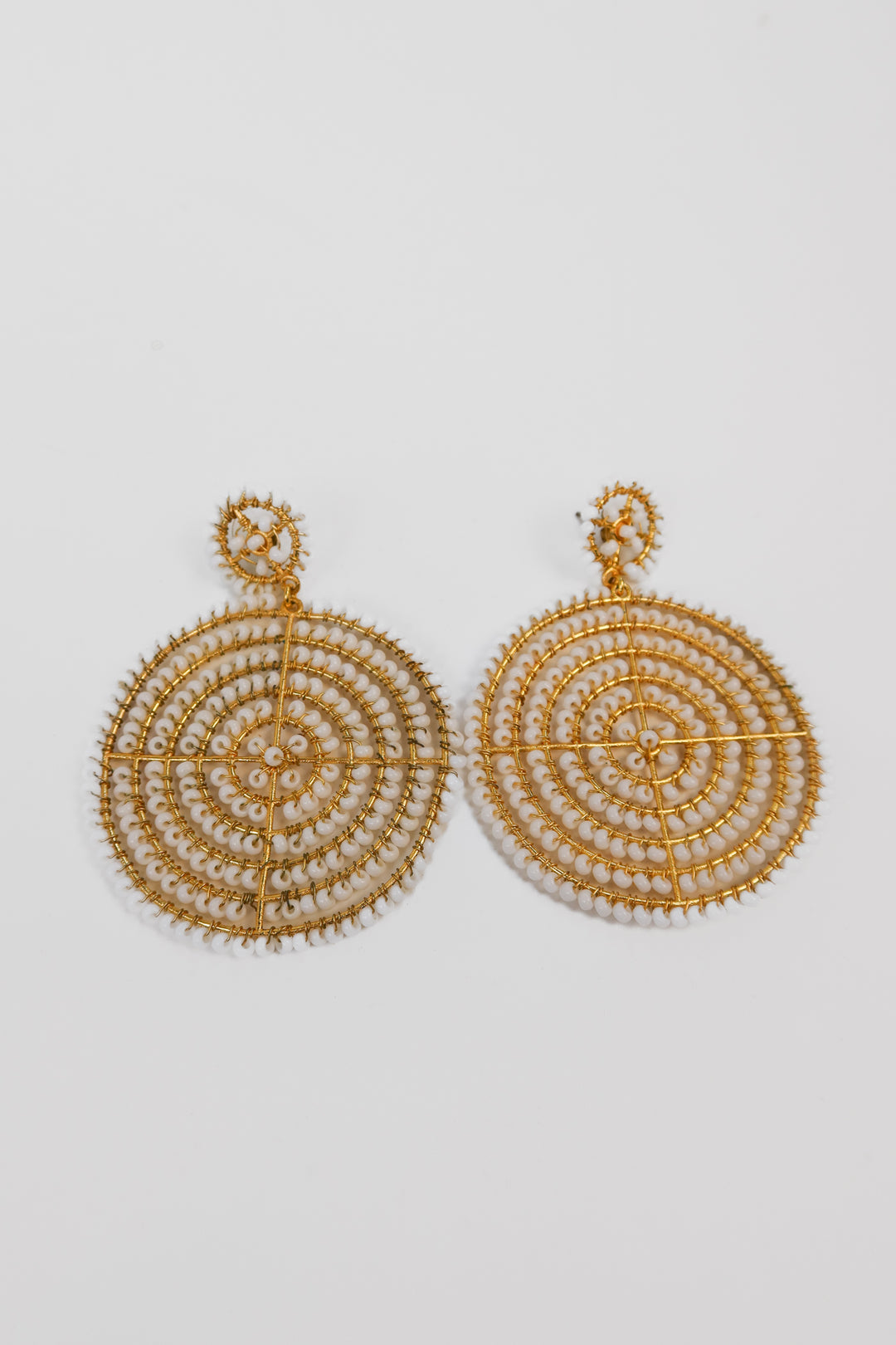 Gold and white beaded circle earrings