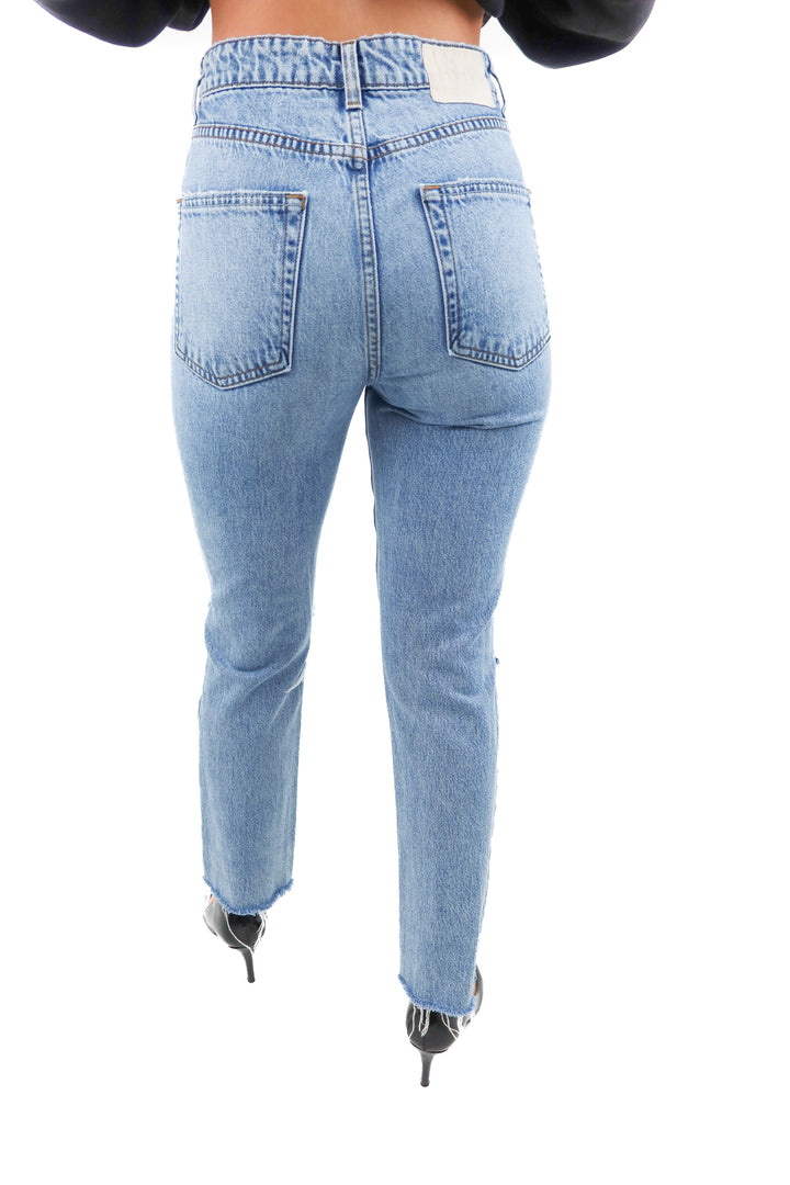 grlfrnd light wash distressed jeans (25; retail $259)