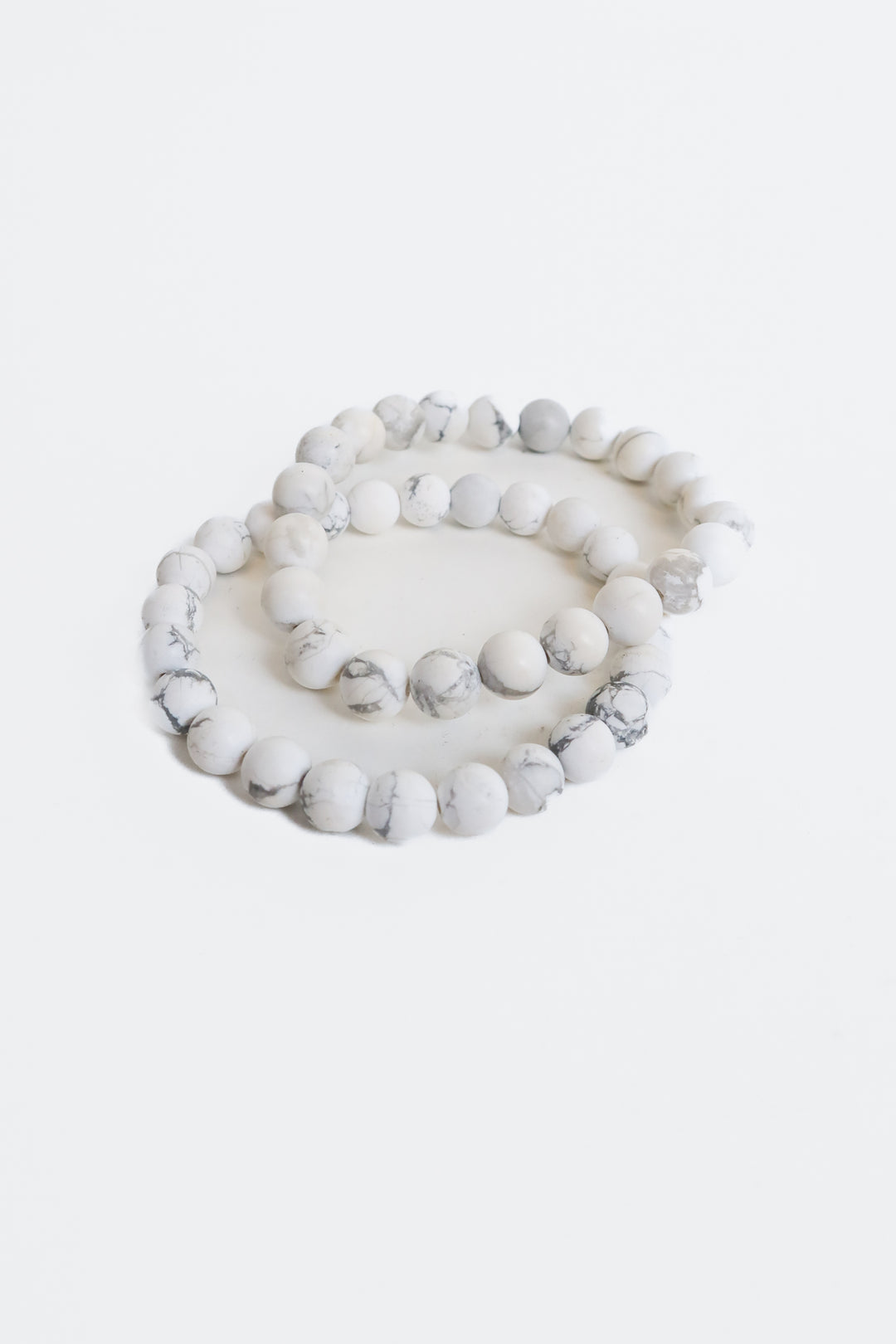 two beaded white marble bracelets