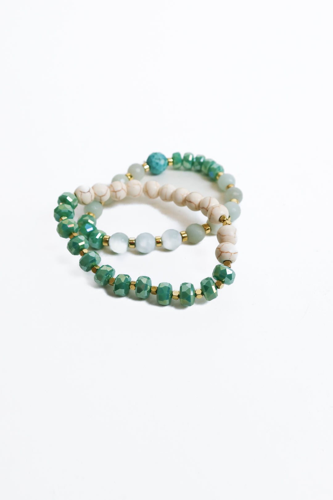 2 green white and gold ball bracelets