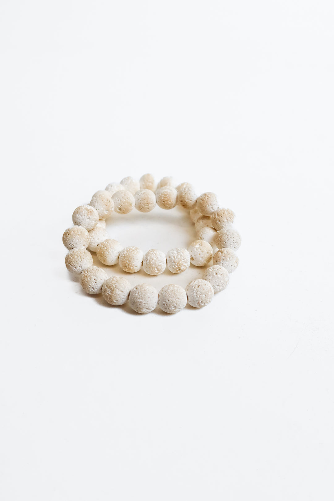 2 white beaded bracelets