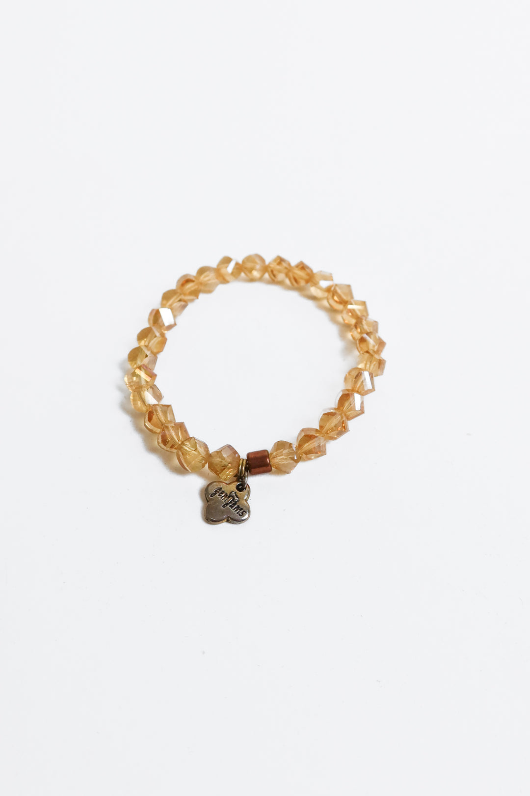 iridescent beaded bracelet with small floral gem