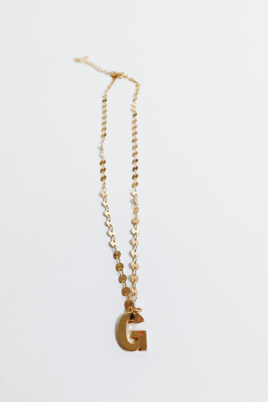 gold “g” necklace