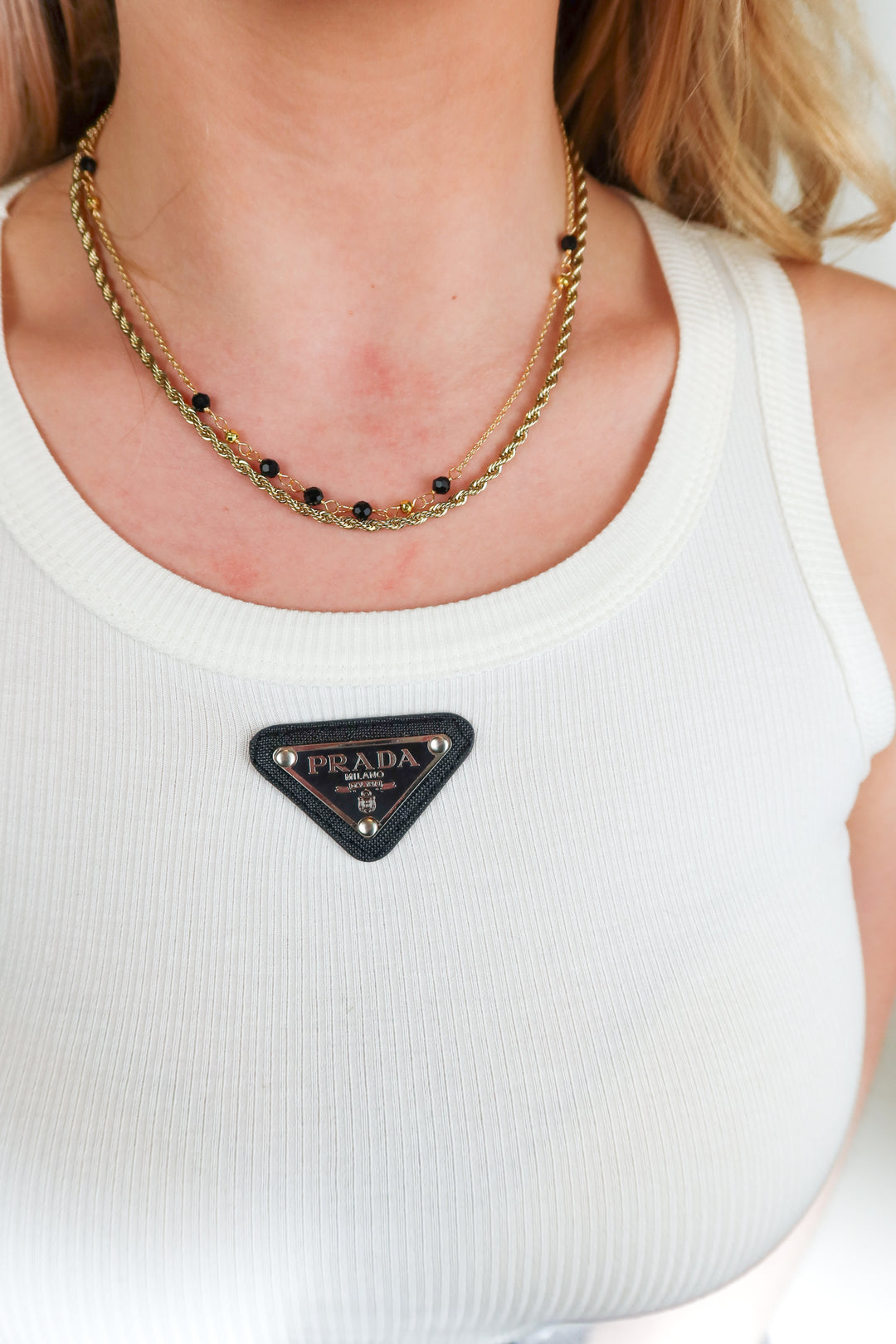 gold rope chain and black beaded necklace