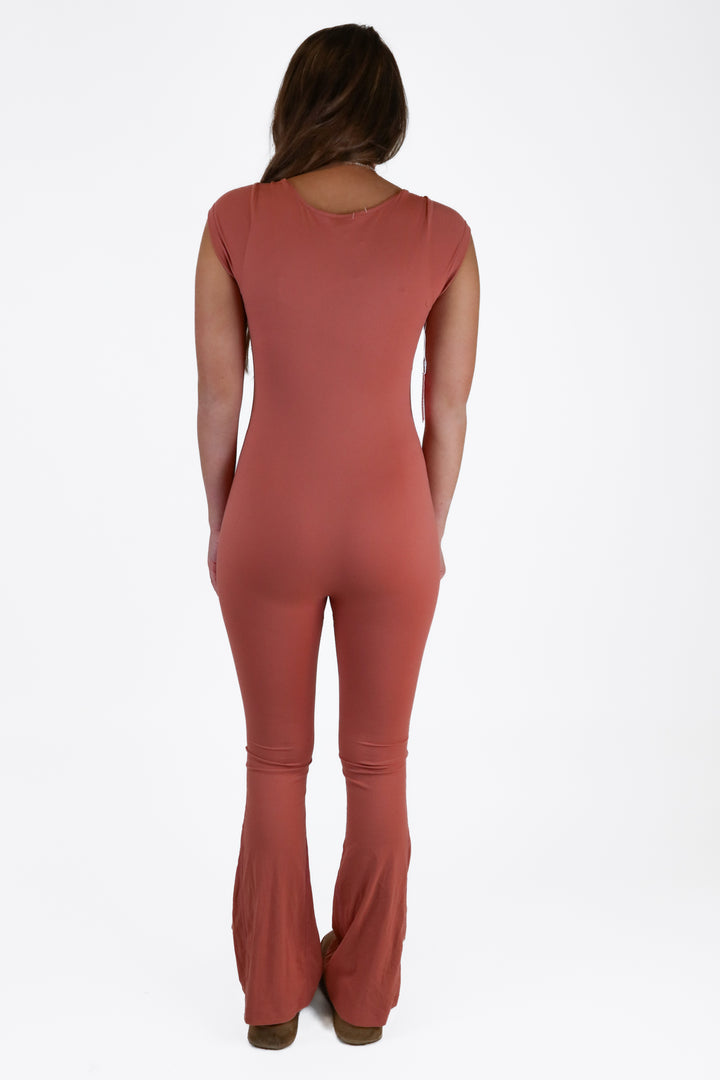 pumiey rust bodycon jumpsuit NWT (S)