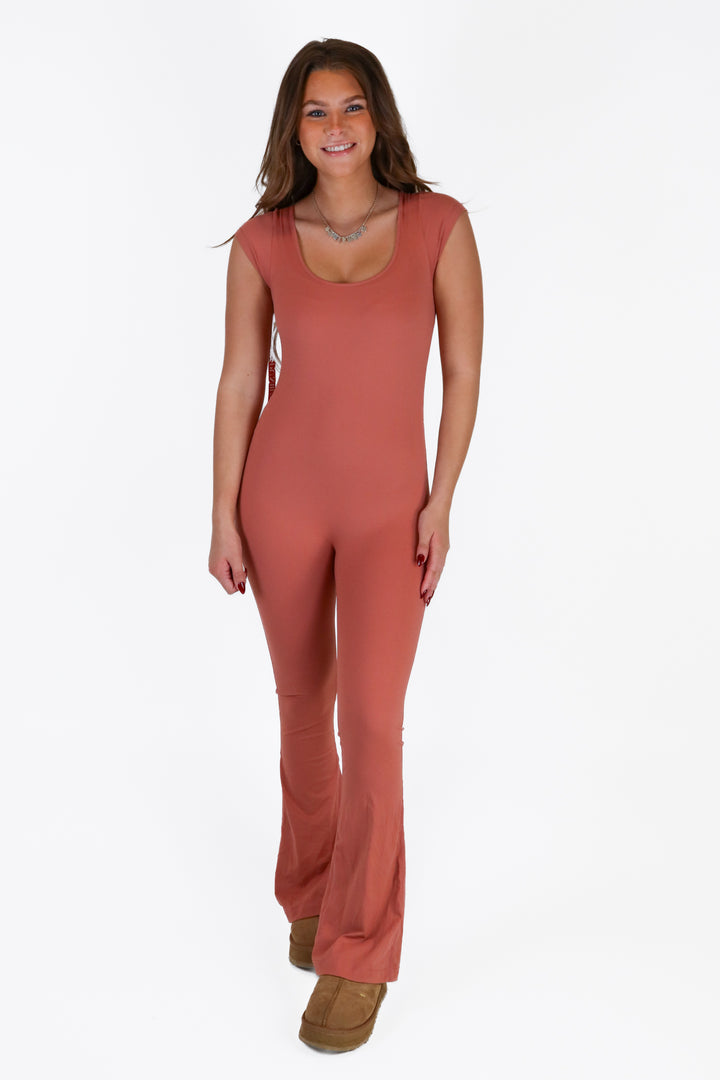 pumiey rust bodycon jumpsuit NWT (S)