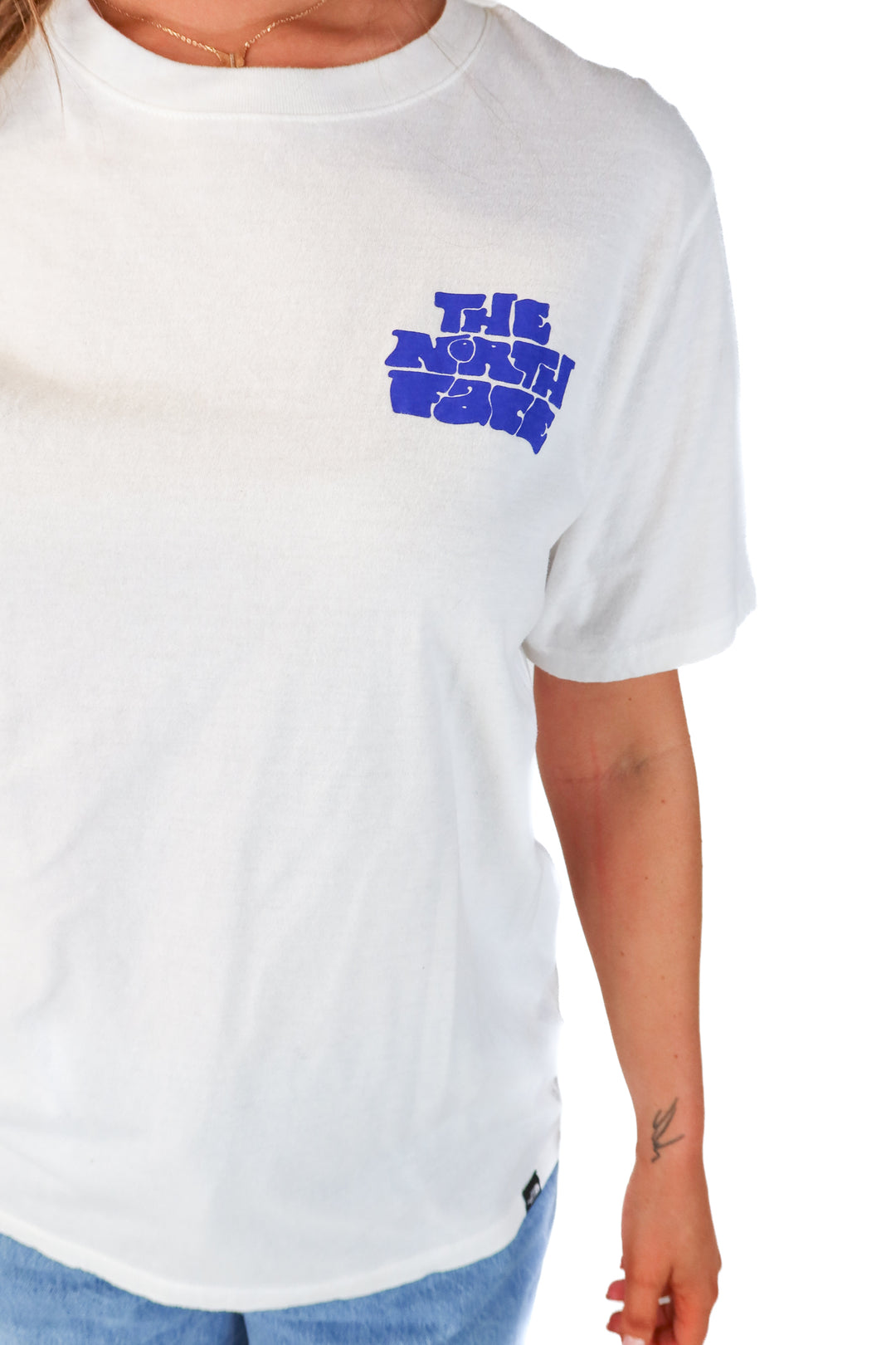 SOLD: the north face white tee (L)