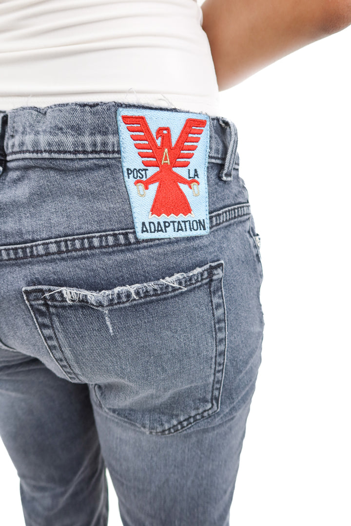 adaptation black distressed jeans (29; retail $325)