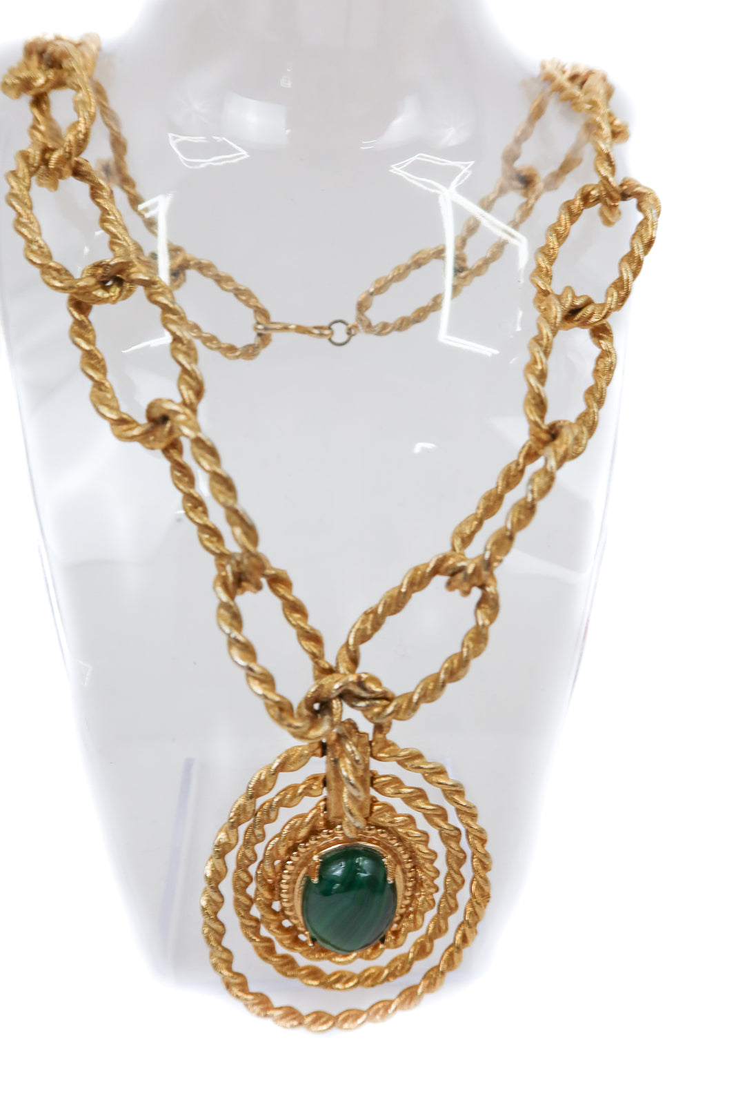 gold chunky necklace with green gem