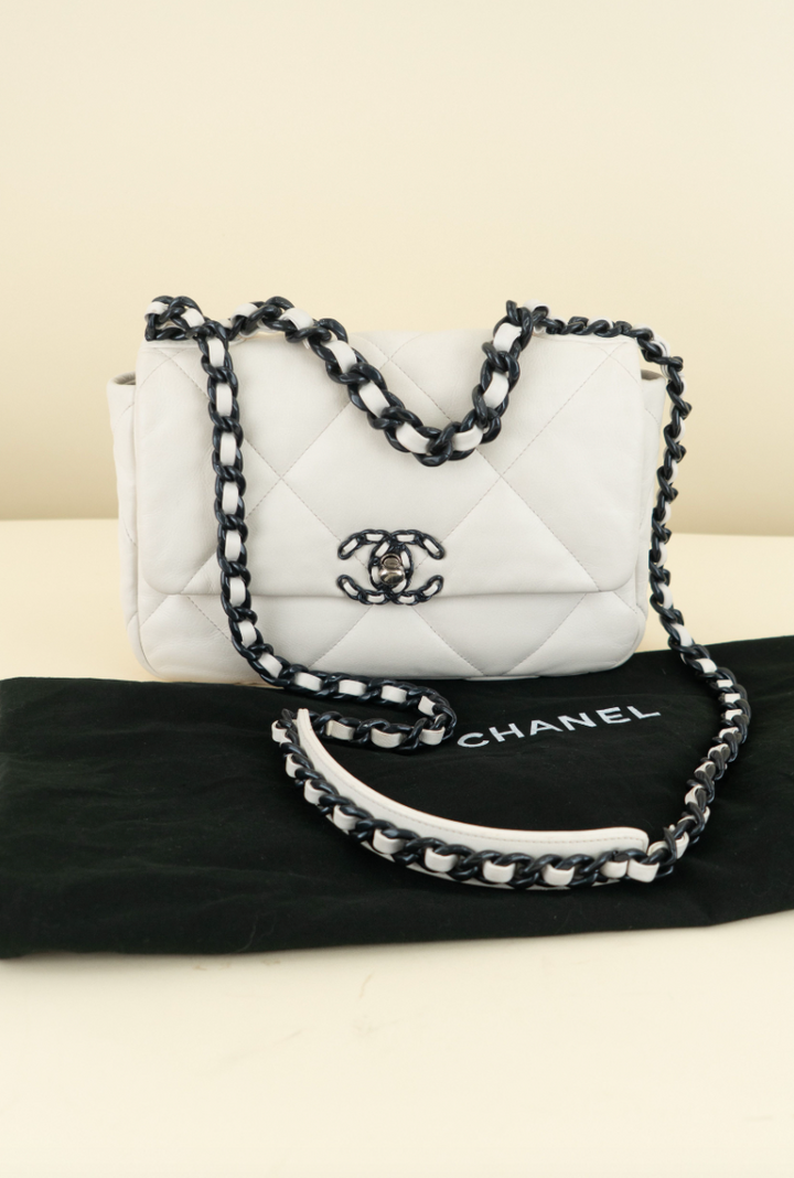 Chanel 19 limited-edition white lambskin with navy (est. retail $6,500)