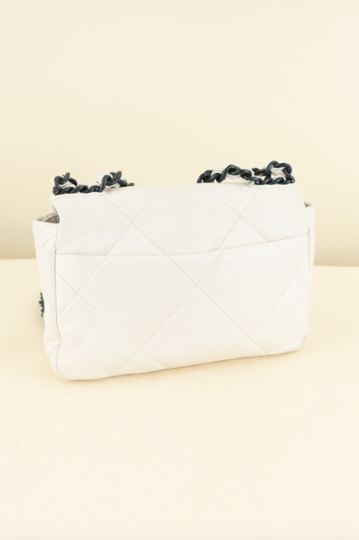 Chanel 19 limited-edition white lambskin with navy (est. retail $6,500)