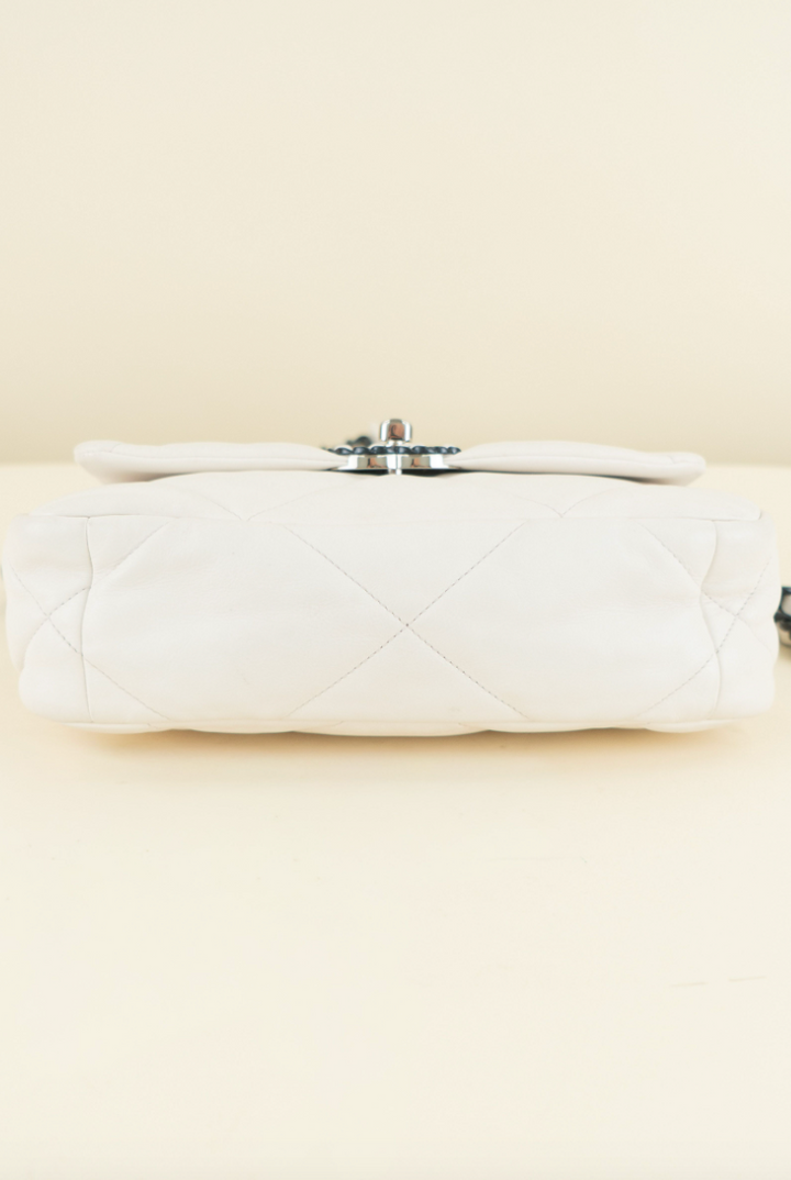 Chanel 19 limited-edition white lambskin with navy (est. retail $6,500)